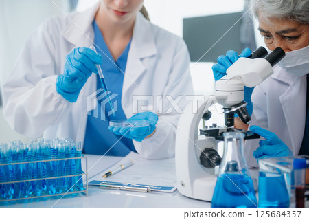 Medical team having a meeting with doctors. Young scientists conducting research investigations 125684357