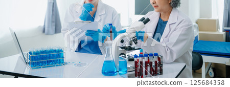 Medical team having a meeting with doctors. Young scientists conducting research investigations 125684358