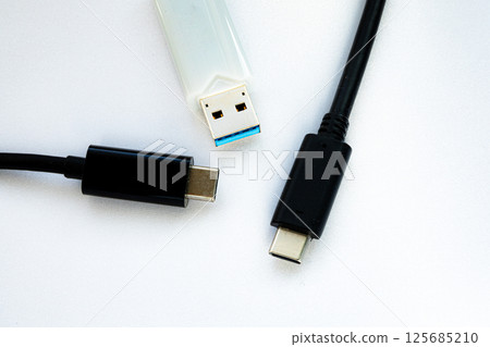 Image of two USB-C and a stick memory on a white background Image of two USB-C and a stick memory on a white background 125685210