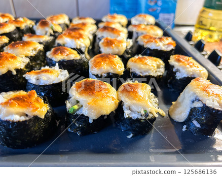 Real homemade sushi rolls with natural unfiltered look. Image for cooking and lifestyle blogs. 125686136