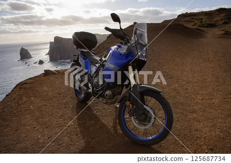 Enduro Motorcycle Standing on a Sea Cliff , Madeira island , Portugal Enduro Motorcycle Standing on a Sea Cliff , Madeira island , Portugal 125687734