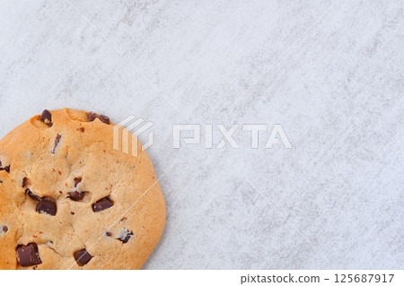 A chocolate chip cookie with a bittersweet flavor A chocolate chip cookie with a bittersweet flavor 125687917
