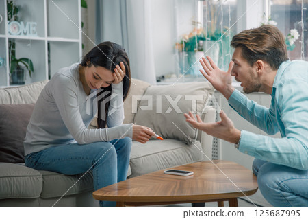 Couple arguing after negative pregnancy test 125687995