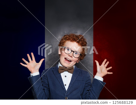 Funny child boy on French flag background. Education, travel, school, camp and study language Funny child boy on French flag background. Education, travel, school, camp and study language 125688129