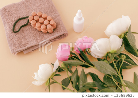 Spa products for facial and body care. Soft terry towel with soap and serum. Spa products for facial and body care. Soft terry towel with soap and serum. 125689623