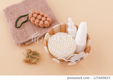 Spa products for facial and body care with soft terry towel. 125689625