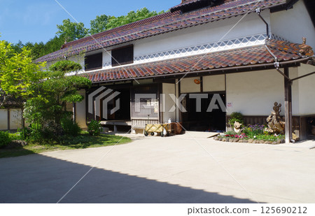 View of the buildings of the wealthy farmer's mansion in Bihoku Hills Park 125690212