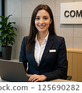 A woman at a real estate agency introducing real estate property information 125690282