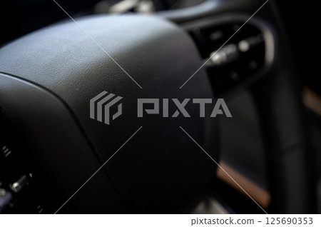 Close-up of black leather seat of modern car Close-up of black leather seat of modern car 125690353