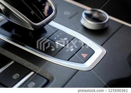 Automatic transmission selector in the interior of a modern car. 125690361