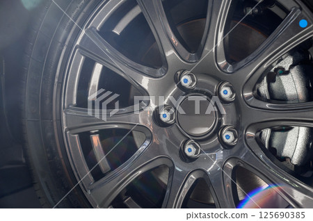 Car wheel with brake calipers and stylish design. Car wheel with brake calipers and stylish design. 125690385