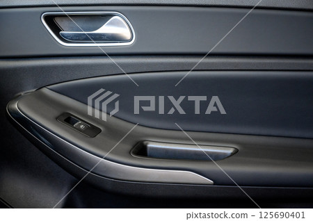 Car door with door handle and window control and adjustment button Car door with door handle and window control and adjustment button 125690401