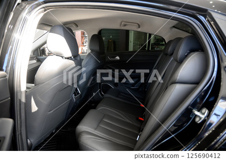 Interior of a modern car with black leather seats Interior of a modern car with black leather seats 125690412