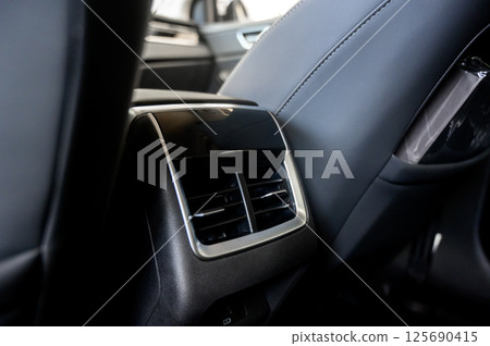 Car air conditioner close-up. Air conditioner flow inside the car. 125690415