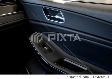 Car door with door handle and window control and adjustment button Car door with door handle and window control and adjustment button 125690421