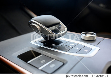 Automatic transmission selector in the interior of a modern car. Automatic transmission selector in the interior of a modern car. 125690521