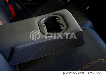 Cup holders inside modern car interior 125690543