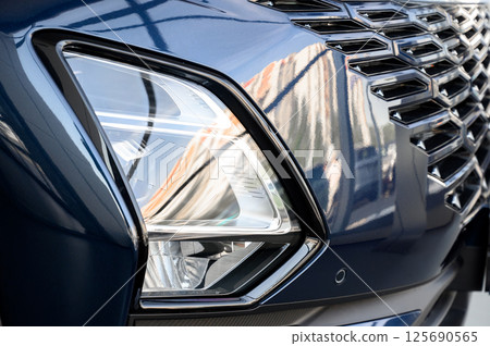 Close up of the headlight of a new modern car 125690565