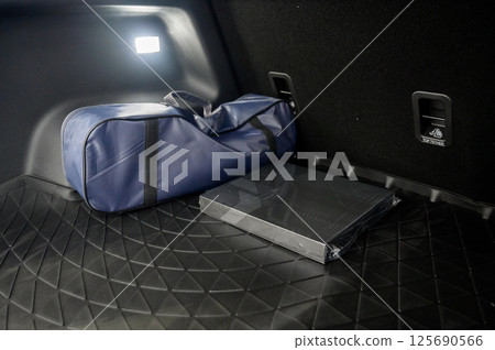 Large black empty car trunk. Open car trunk close up Large black empty car trunk. Open car trunk close up 125690566