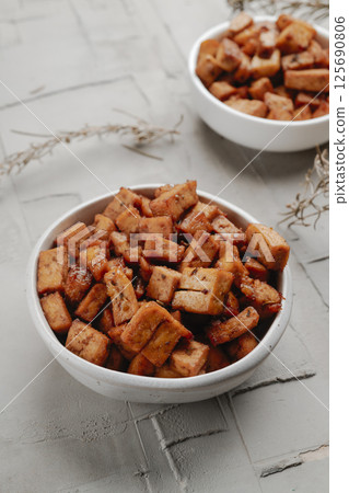 diced marinated tofu in a pair of white bowls diced marinated tofu in a pair of white bowls 125690806
