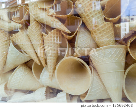 Stack of empty waffle ice cream cones 125692408