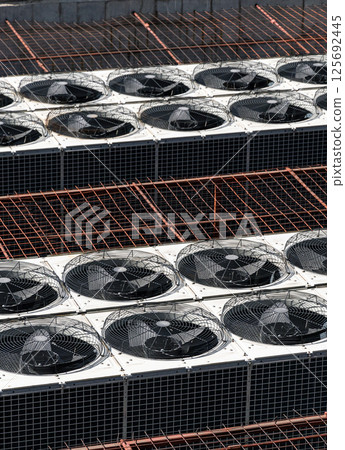 Large industrial air conditioners on rooftop 125692445