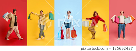 Shopping Studio Collage. People joyfully holding colorful shopping bags against solid backgrounds symbolizing consumerism happiness trend and personal taste. 125692457