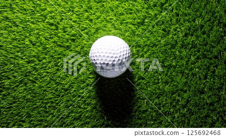 Golf image: Golf ball and grass seen from above. Stylish background material. AI-generated material. 125692468