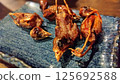 Round grilled sparrows 125692588