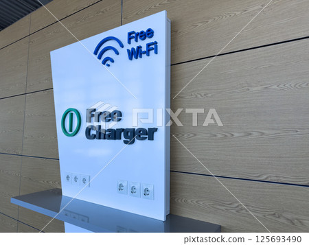 Tech-friendly corner with free Wi Fi and charging options, supporting digital connectivity and convenience for users in high traffic environments like terminals or cafes 125693490