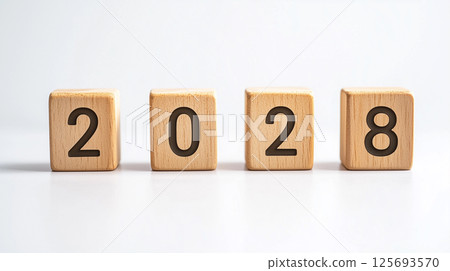 Numbers 2028 carved into a natural wooden block | Clear impression 125693570