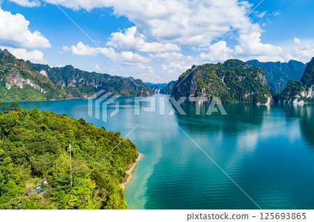 Aerial view drone shot of scenery mountains tropical rainforest in thailand,Khao Sok Thailand Scenic mountains with lake in Khao Sok National Park 125693865