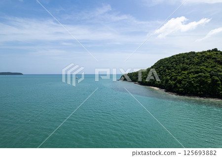 Aerial view of a blue sea surface water texture background and sun reflections Aerial flying drone view Waves water surface texture on sunny tropical ocean in Phuket island Thailand 125693882