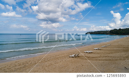 Aerial view of a blue sea surface water texture background and sun reflections Aerial flying drone view Waves water surface texture on sunny tropical ocean in Phuket island Thailand 125693893