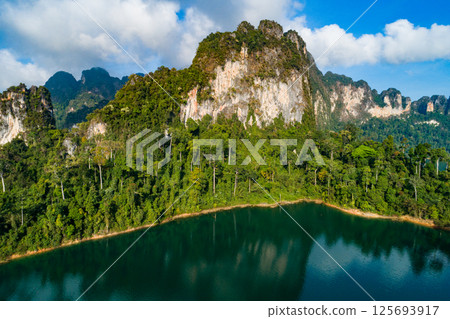 Aerial view drone shot of scenery mountains tropical rainforest in thailand,Khao Sok Thailand Scenic mountains with lake in Khao Sok National Park 125693917