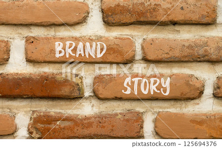 Brand story symbol. Concept words Brand story on beautiful brown brick wall. Beautiful brown brick wall background. Business brand story concept. Copy space. Brand story symbol. Concept words Brand story on beautiful brown brick wall. Beautiful brown brick wall background. Business brand story concept. Copy space. 125694376