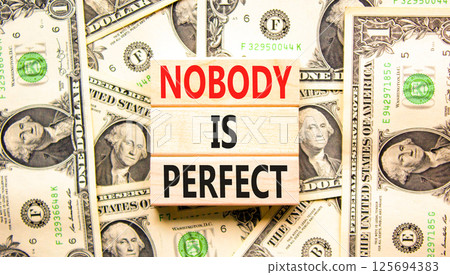 Nobody is perfect symbol. Concept words Nobody is perfect on beautiful block. Dollar bills. Beautiful background from dollar bills. Business motivational lifestyle nobody is perfect concept Copy space Nobody is perfect symbol. Concept words Nobody is perfect on beautiful block. Dollar bills. Beautiful background from dollar bills. Business motivational lifestyle nobody is perfect concept Copy space 125694383