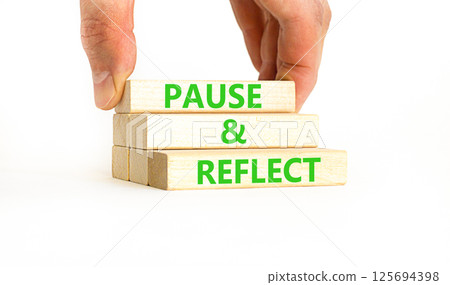 Pause and reflect symbol. Concept words Pause and reflect on beautiful block. Businessman's hand. Beautiful white background. Business motivational lifestyle pause and reflect concept. Copy space. Pause and reflect symbol. Concept words Pause and reflect on beautiful block. Businessman's hand. Beautiful white background. Business motivational lifestyle pause and reflect concept. Copy space. 125694398