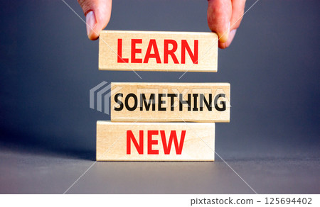 Learn something new symbol. Concept words Learn something new on beautiful block. Businessman's hand. Beautiful grey background Business motivational lifestyle learn something new concept Copy space Learn something new symbol. Concept words Learn something new on beautiful block. Businessman's hand. Beautiful grey background Business motivational lifestyle learn something new concept Copy space 125694402