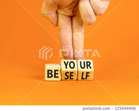 Motivational be yourself symbol. Concept words Be yourself on beautiful wooden block. Beautiful orange background Businessman hand. Business motivational be yourself concept. Copy space. 125694408