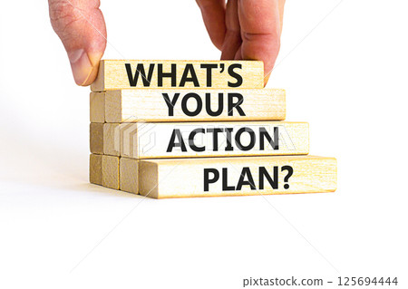 Action plan symbol. Concept words What is your action plan on beautiful wooden blocks. Beautiful white table white background. Businessman hand. Business What is your action plan concept. Copy space 125694444