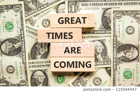 Great times are coming symbol. Concept words Great times are coming on beautiful wooden blocks. Beautiful background from dollar bills. Business great times are coming concept. Copy space. Great times are coming symbol. Concept words Great times are coming on beautiful wooden blocks. Beautiful background from dollar bills. Business great times are coming concept. Copy space. 125694447