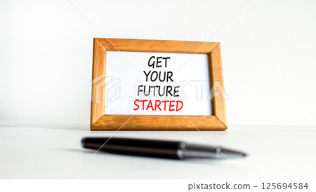 Get your future started symbol. Concept words Get your future started on beautiful wooden picture frame. Beautiful white table white background. Business get your future started concept. Copy space. Get your future started symbol. Concept words Get your future started on beautiful wooden picture frame. Beautiful white table white background. Business get your future started concept. Copy space. 125694584