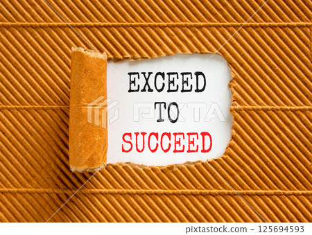 Exceed to succeed symbol. Concept words Exceed to succeed on beautiful white paper. Beautiful brown paper background. Business and exceed to succeed concept. Copy space. 125694593