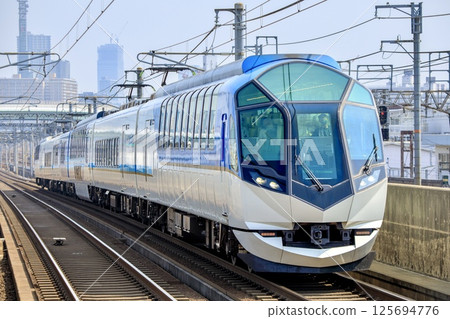 The Shimakaze tourist express train runs on the elevated section of the Kintetsu Nagoya Line 125694776