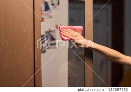 Meticulously Cleaning the Glass Surface with Care and Attention to Detail and Efficiency 125697563