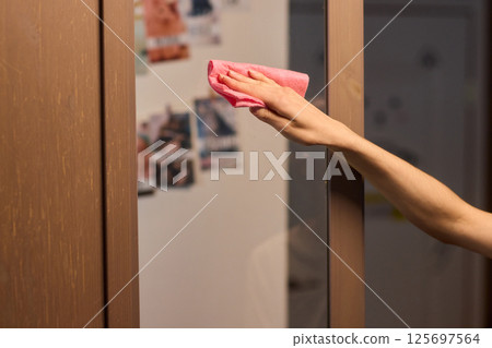 Meticulously Cleaning the Glass Surface with Care and Attention to Detail and Efficiency 125697564