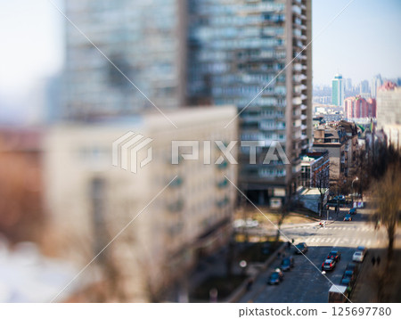 Unique tilt-shift perspective of a vibrant Kyiv city street scene Unique tilt-shift perspective of a vibrant Kyiv city street scene 125697780
