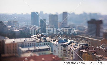 Unique tilt-shift perspective of a vibrant Kyiv city street scene 125697786