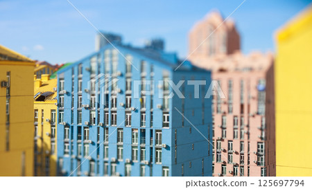 Vibrant tilt-shift image showcasing the colorful modern residential architecture of Comfort Town Vibrant tilt-shift image showcasing the colorful modern residential architecture of Comfort Town 125697794